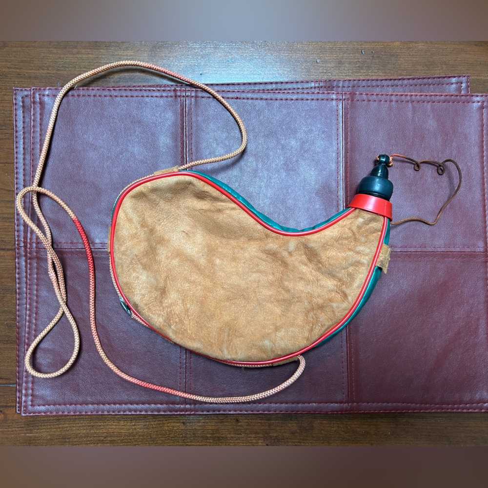 Tan and Red Leather Wine Skin Bottle Bag, vintage-as is.